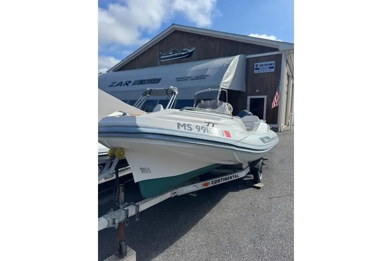 Slide: The Image of 2018 Zar Formenti 49 SL boat on trailer outside dealership. - 3