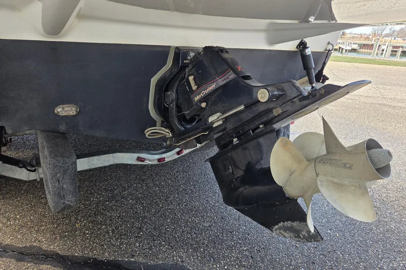 Slide: The Image of 2014 Rinker 290 Express Cruiser boat propeller and outdrive on trailer. - 10