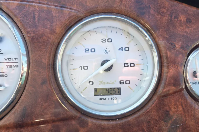 Slide: The Image of Close-up of a 2014 Rinker 290 Express Cruiser tachometer displaying 425.7 RPM. - 12