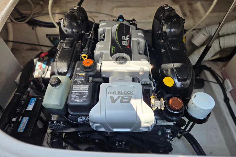 Slide: The Image of Engine compartment of a 2014 Rinker 290 Express Cruiser with a Big Block V8 engine. - 4
