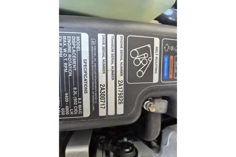 Slide: The Image of Engine specifications label on 2014 Rinker 290 Express Cruiser, showing serial numbers and belt routing. - 8