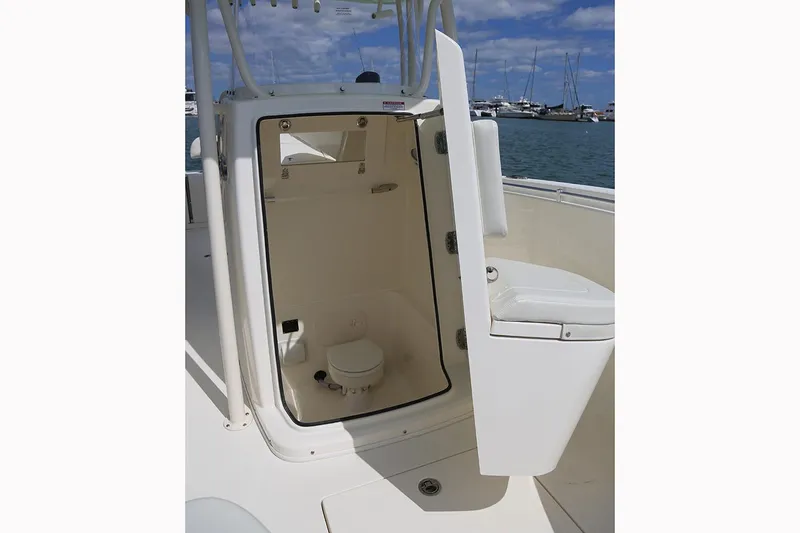 Slide: The Image of Manufacturer Provided Image: 2018 Cobia 261 Center Console boat with open head compartment. - 16
