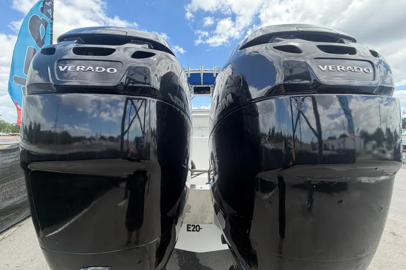 Slide: The Image of Twin Verado outboard engines on a 2006 Ocean Runner 2900 C/C Open Fisherman boat. - 11