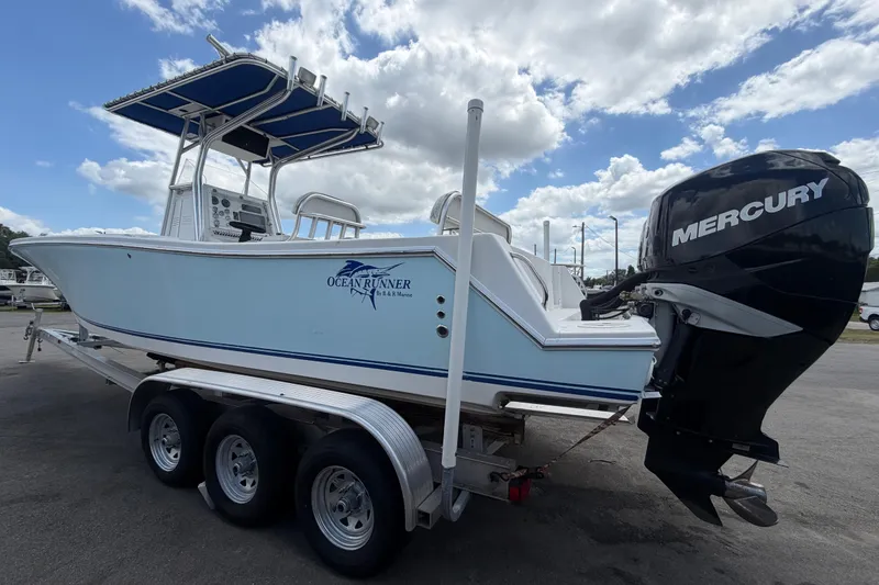 Slide: The Image of 2006 Ocean Runner 2900 C/C Open Fisherman boat with Mercury engine on trailer. - 16
