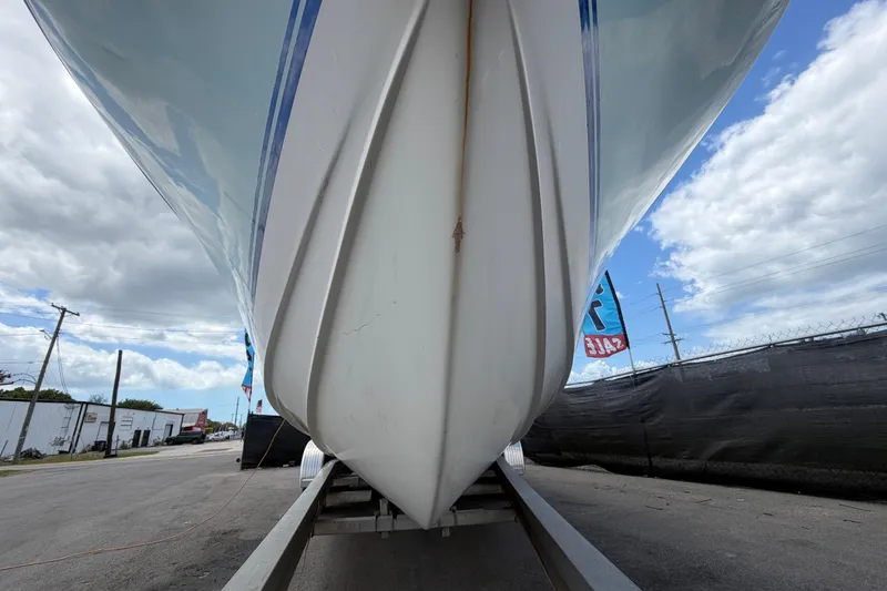 Slide: The Image of 2006 Ocean Runner 2900 C/C Open Fisherman boat on trailer, under cloudy sky. - 20