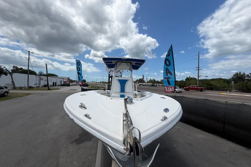 Slide: The Image of 2006 Ocean Runner 2900 C/C Open Fisherman boat displayed for sale under cloudy sky. - 22