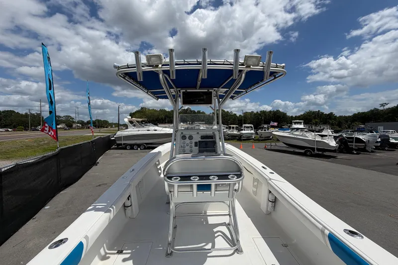 Slide: The Image of 2006 Ocean Runner 2900 C/C Open Fisherman boat at a dealership under a cloudy sky. - 27