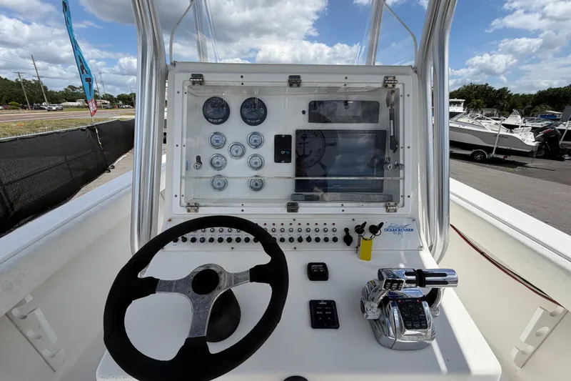 Slide: The Image of 2006 Ocean Runner 2900 C/C Open Fisherman dashboard with steering wheel and controls. - 31