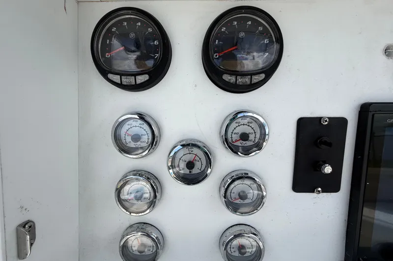 Slide: The Image of Dashboard of a 2006 Ocean Runner 2900 C/C Open Fisherman boat with gauges and controls. - 34