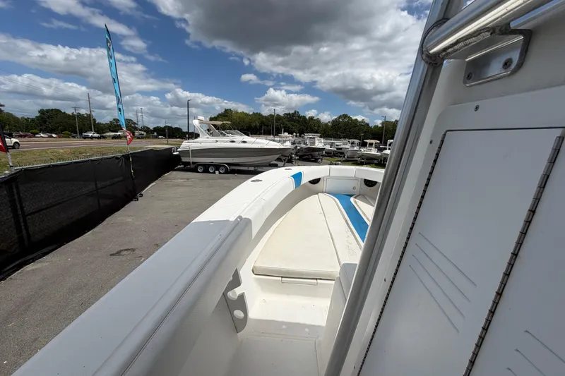 Slide: The Image of 2006 Ocean Runner 2900 C/C Open Fisherman boat on display under cloudy sky. - 41