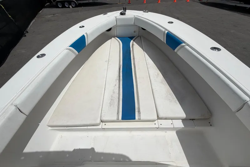 Slide: The Image of 2006 Ocean Runner 2900 C/C Open Fisherman boat interior with blue and white seating. - 42