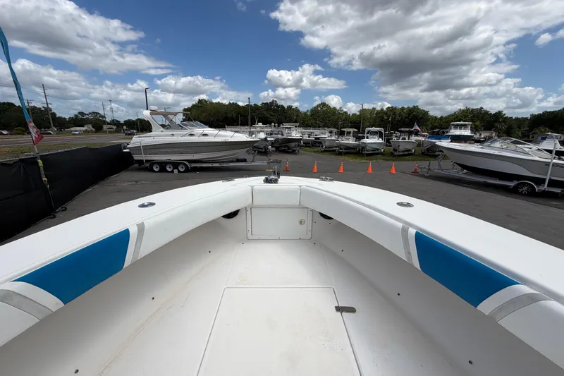 Slide: The Image of 2006 Ocean Runner 2900 C/C Open Fisherman boat at a marina under cloudy skies. - 46