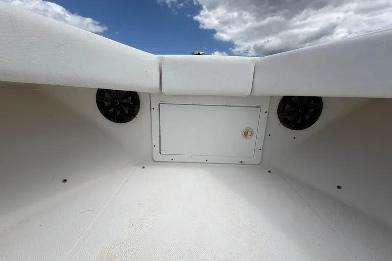 Slide: The Image of Interior view of 2006 Ocean Runner 2900 C/C Open Fisherman boat, featuring storage compartment and speakers. - 47