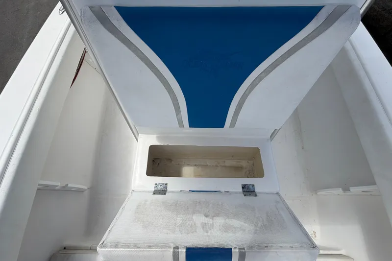 Slide: The Image of Open storage compartment on a 2006 Ocean Runner 2900 C/C Open Fisherman boat. - 53