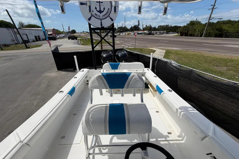 Slide: The Image of 2006 Ocean Runner 2900 C/C Open Fisherman boat interior with seating and steering wheel. - 57