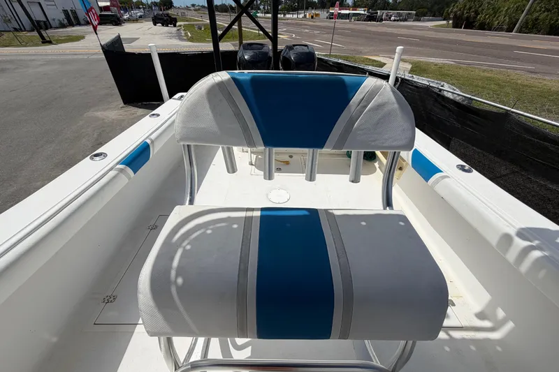 Slide: The Image of 2006 Ocean Runner 2900 C/C Open Fisherman boat interior with blue and white seating. - 58