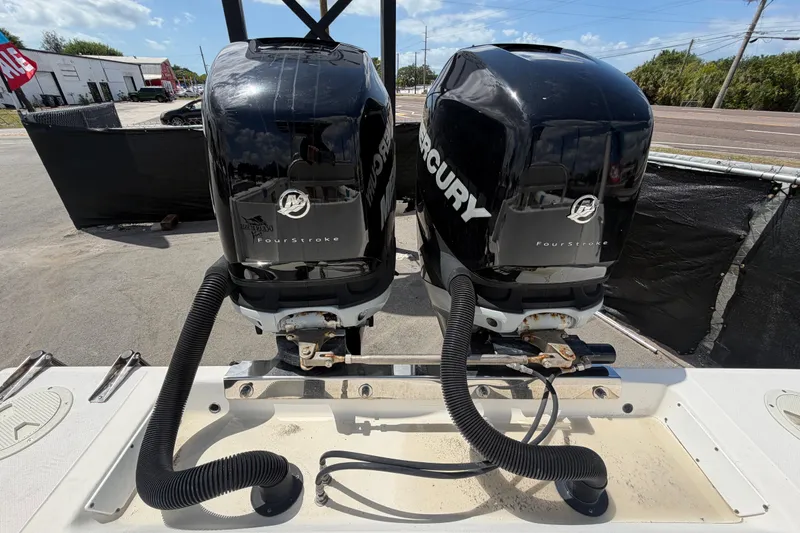 Slide: The Image of Twin Mercury FourStroke engines on a 2006 Ocean Runner 2900 C/C Open Fisherman boat. - 60