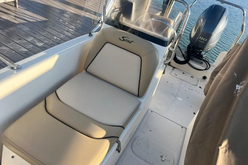 Slide: The Image of 2018 Scout 175 Sport Dorado boat interior with seating and Yamaha 90 outboard motor. - 6