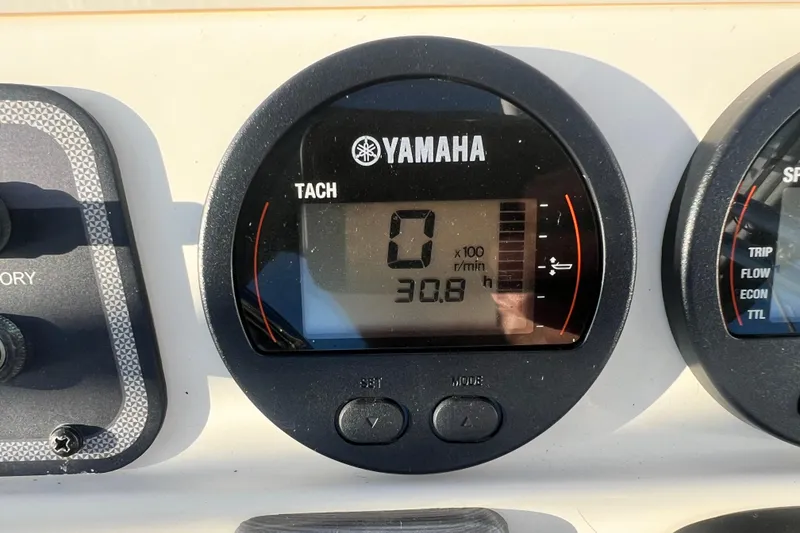 Slide: The Image of Yamaha tachometer on 2018 Scout 175 Sport Dorado boat dashboard, displaying 0 RPM and 30.8 hours. - 9