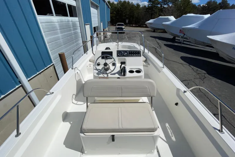 Slide: The Image of 2019 Boston Whaler 190 Montauk boat interior with steering console and seating. - 5