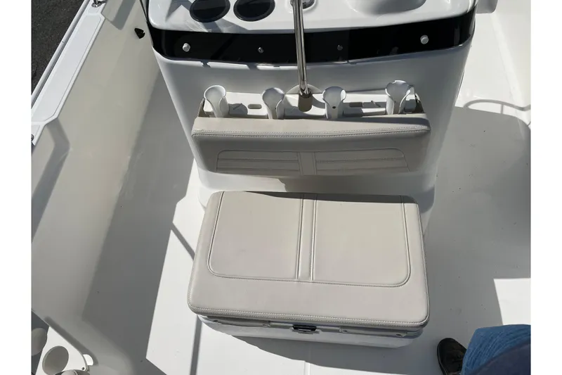 Slide: The Image of 2019 Boston Whaler 190 Montauk boat interior with seating and rod holders. - 6