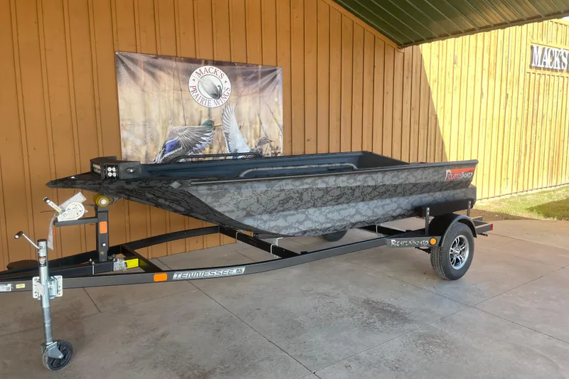 The Image of 2026 Reaper Boats 553 Timber Reaper on trailer, displayed outdoors. - 0