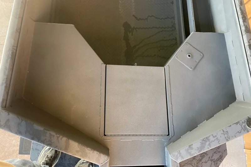 Slide: The Image of Interior view of 2026 Reaper Boats 553 Timber Reaper, showcasing sleek design and storage area. - 11