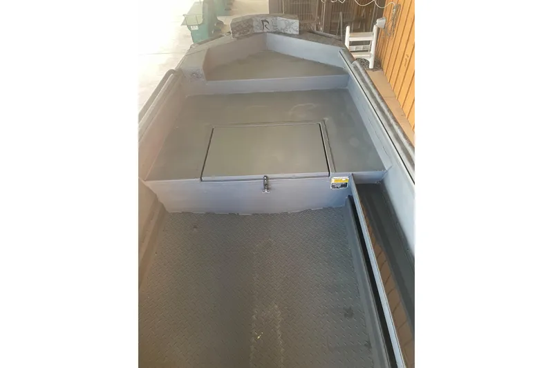 Slide: The Image of 2026 Reaper Boats 553 Timber Reaper interior with storage compartment, showcasing durable design. - 12