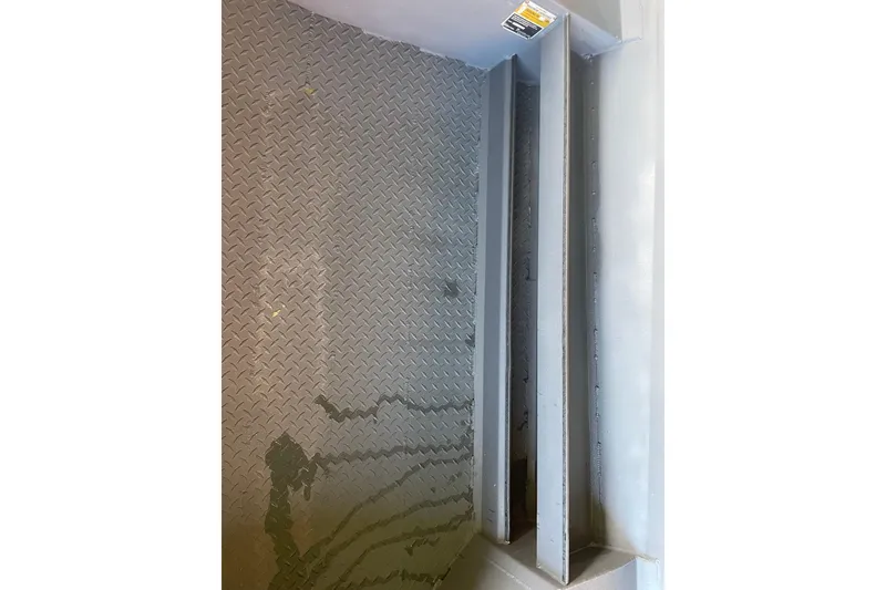 Slide: The Image of Interior view of 2026 Reaper Boats 553 Timber Reaper with diamond plate flooring. - 13