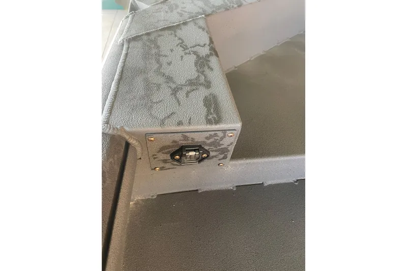 Slide: The Image of 2026 Reaper Boats 553 Timber Reaper interior detail with textured surface and hardware. - 4