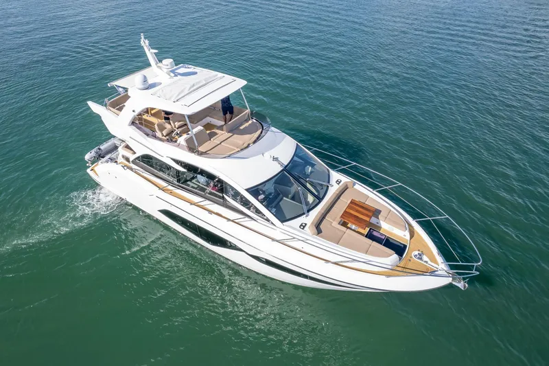 Slide: The Image of 2018 Sunseeker Manhattan 52 yacht cruising on calm waters. - 11