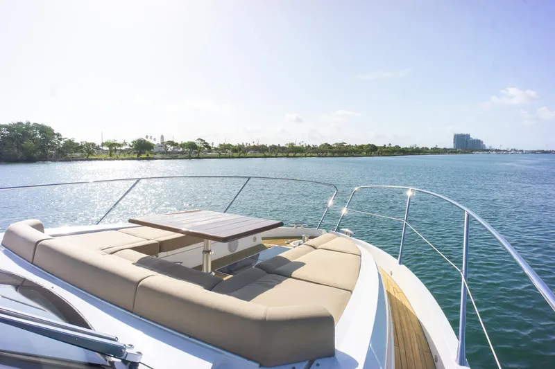 Slide: The Image of Luxurious 2018 Sunseeker Manhattan 52 yacht with sun deck on tranquil water. - 24