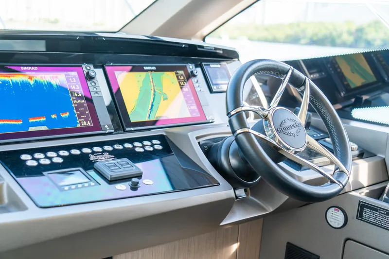 Slide: The Image of Cockpit of 2018 Sunseeker Manhattan 52 yacht with advanced navigation displays. - 27