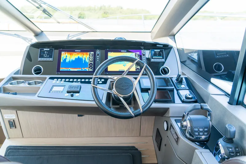 Slide: The Image of Cockpit of 2018 Sunseeker Manhattan 52 yacht with advanced navigation systems. - 29