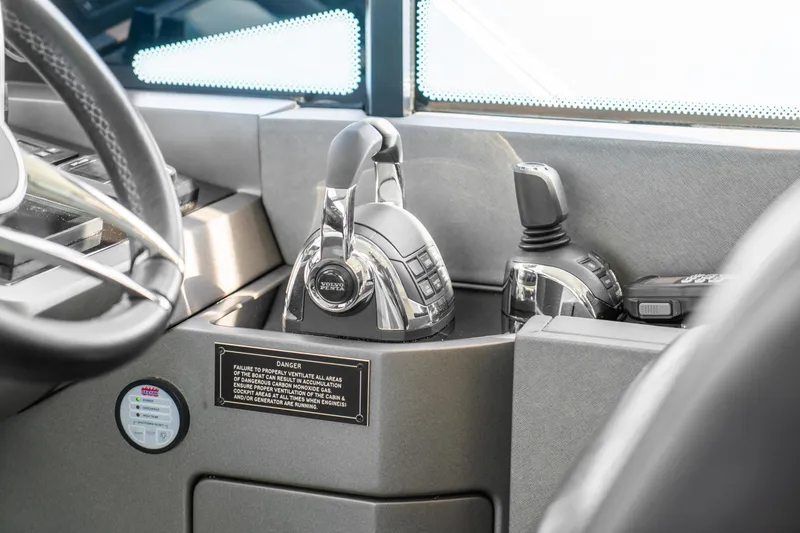Slide: The Image of Control panel of a 2018 Sunseeker Manhattan 52 yacht with Volvo Penta throttle. - 30
