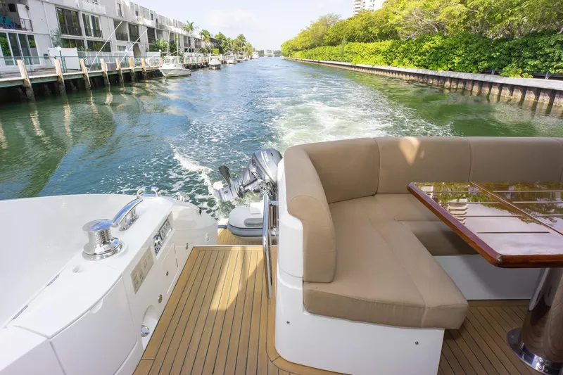 Slide: The Image of Luxurious 2018 Sunseeker Manhattan 52 yacht cruising along a scenic canal. - 31