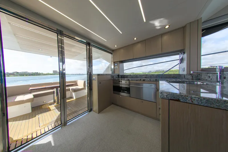 Slide: The Image of Luxurious interior of 2018 Sunseeker Manhattan 52 yacht with modern kitchen and scenic views. - 32