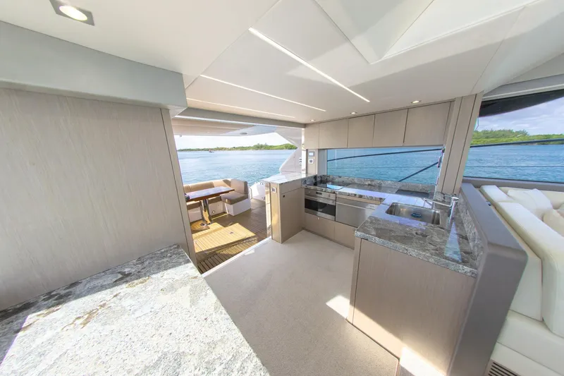 Slide: The Image of Luxurious interior of 2018 Sunseeker Manhattan 52 yacht with modern kitchen and scenic ocean view. - 33