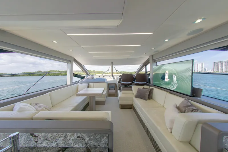 Slide: The Image of Luxurious interior of 2018 Sunseeker Manhattan 52 yacht with panoramic windows and plush seating. - 35