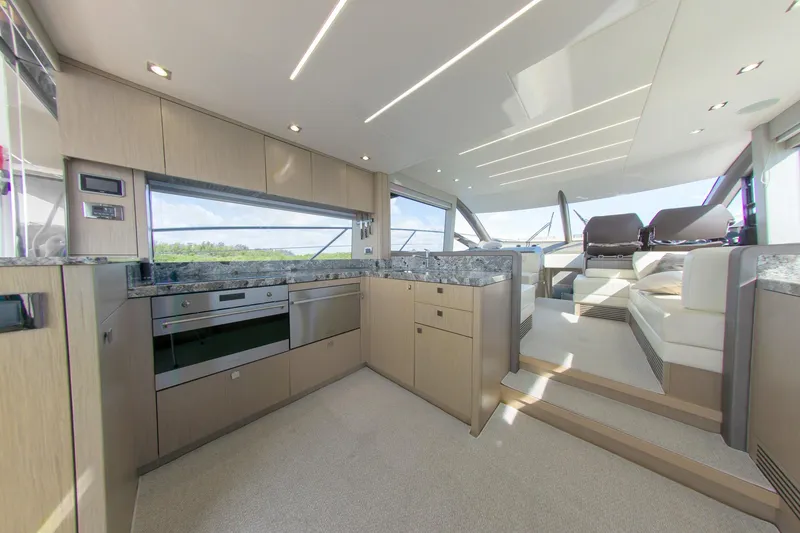 Slide: The Image of Luxurious interior of 2018 Sunseeker Manhattan 52 yacht with modern kitchen and seating area. - 36