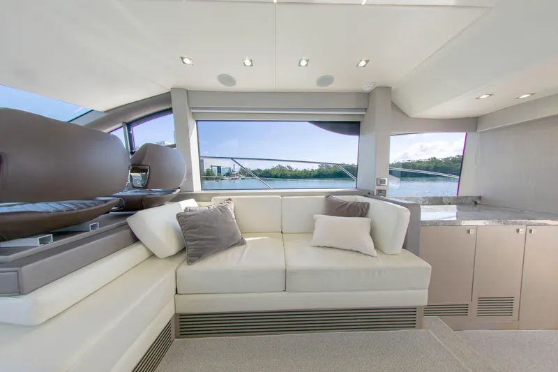 Slide: The Image of Luxurious interior of 2018 Sunseeker Manhattan 52 yacht with plush seating and scenic window view. - 37