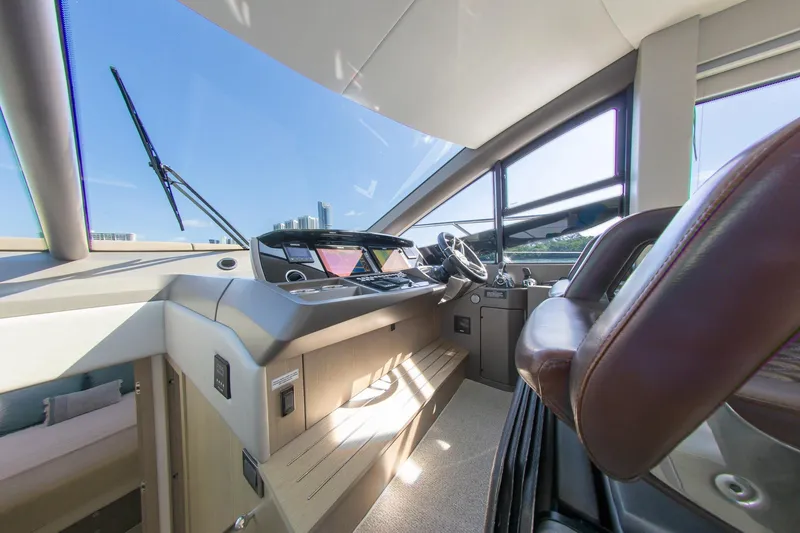 Slide: The Image of Interior helm of 2018 Sunseeker Manhattan 52 yacht with modern controls and leather seating. - 39