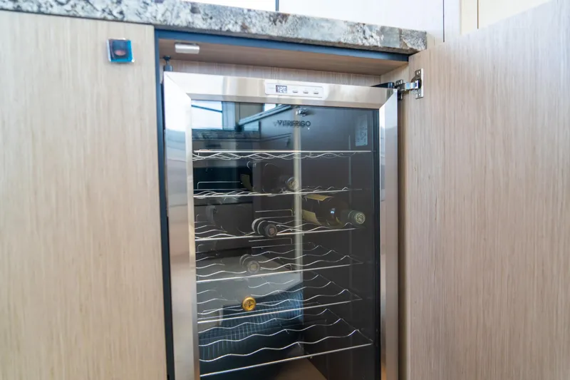 Slide: The Image of Wine cooler in 2018 Sunseeker Manhattan 52 yacht interior, showcasing luxury amenities. - 43
