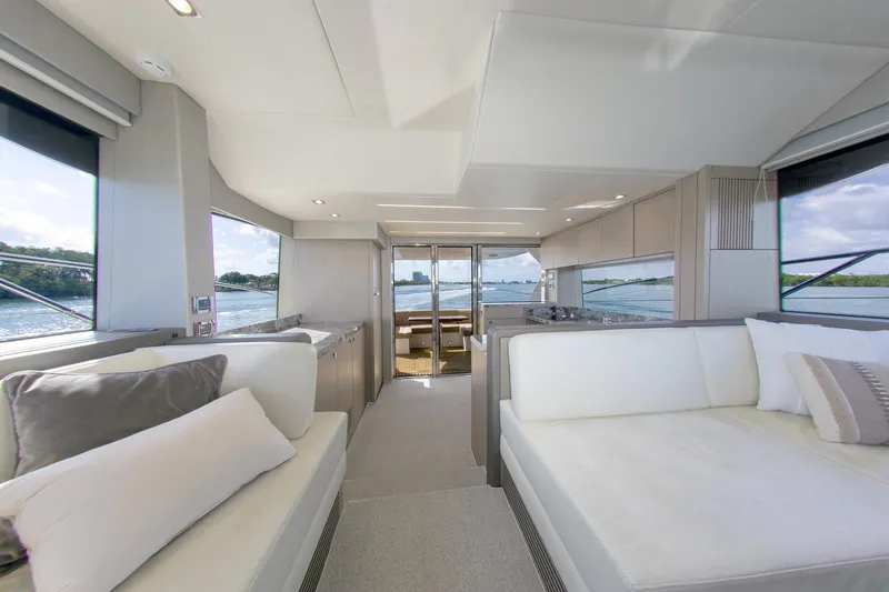 Slide: The Image of Luxurious interior of 2018 Sunseeker Manhattan 52 yacht with elegant seating and panoramic windows. - 46