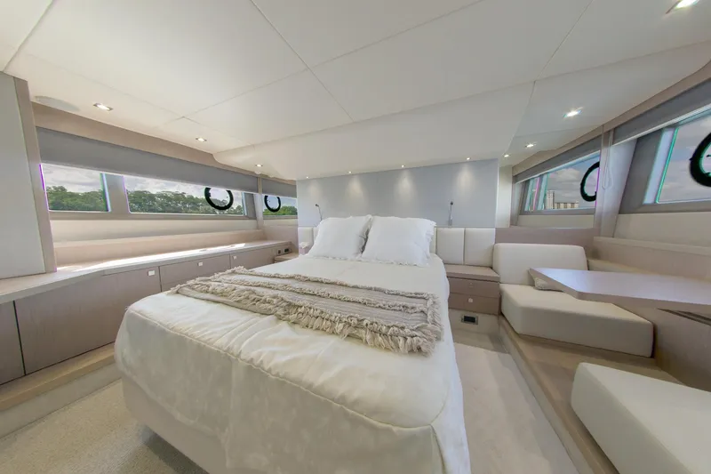Slide: The Image of Luxurious bedroom interior of 2018 Sunseeker Manhattan 52 yacht, featuring elegant design and ample natural light. - 47
