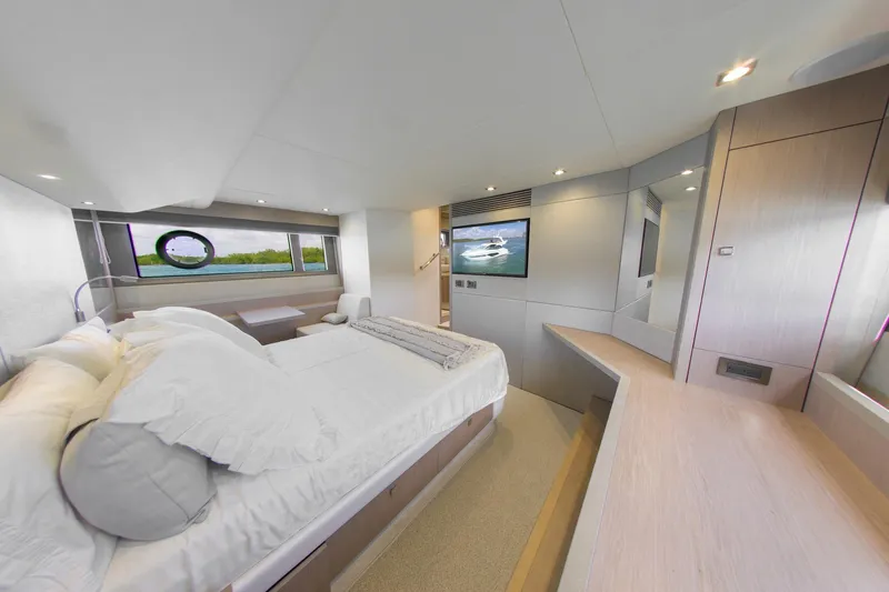 Slide: The Image of Luxurious interior of 2018 Sunseeker Manhattan 52 yacht, featuring a spacious bedroom with modern amenities. - 49