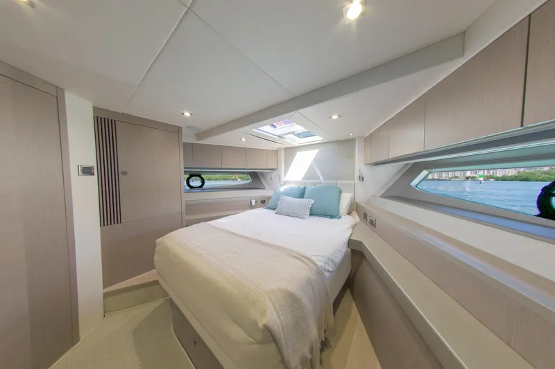 Slide: The Image of Luxurious bedroom interior of 2018 Sunseeker Manhattan 52 yacht with modern design and scenic windows. - 54