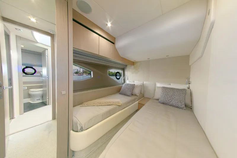 Slide: The Image of Luxurious interior of 2018 Sunseeker Manhattan 52 yacht with twin beds and ensuite bathroom. - 58