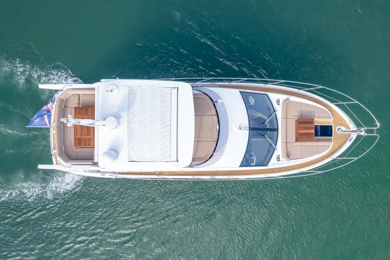 Slide: The Image of Overhead view of 2018 Sunseeker Manhattan 52 yacht cruising on water. - 6