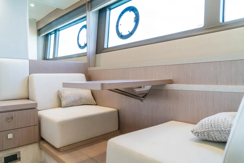 Slide: The Image of Luxurious interior of 2018 Sunseeker Manhattan 52 yacht with elegant seating and table. - 63